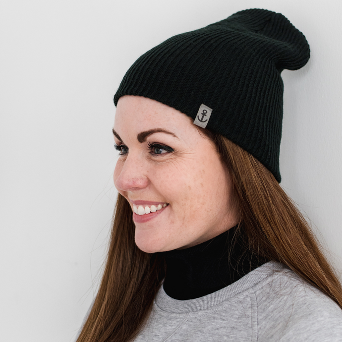 Dr. Robyne in a black beanie with anchor